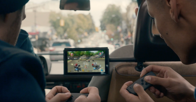 Two players use one Joy-Con each to play Mario Kart 8
